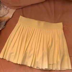 Yellow Aritzia TNA micro workout skort